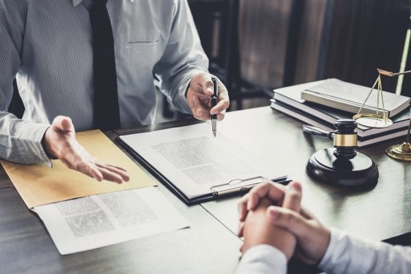 Two professionals meeting at a desk