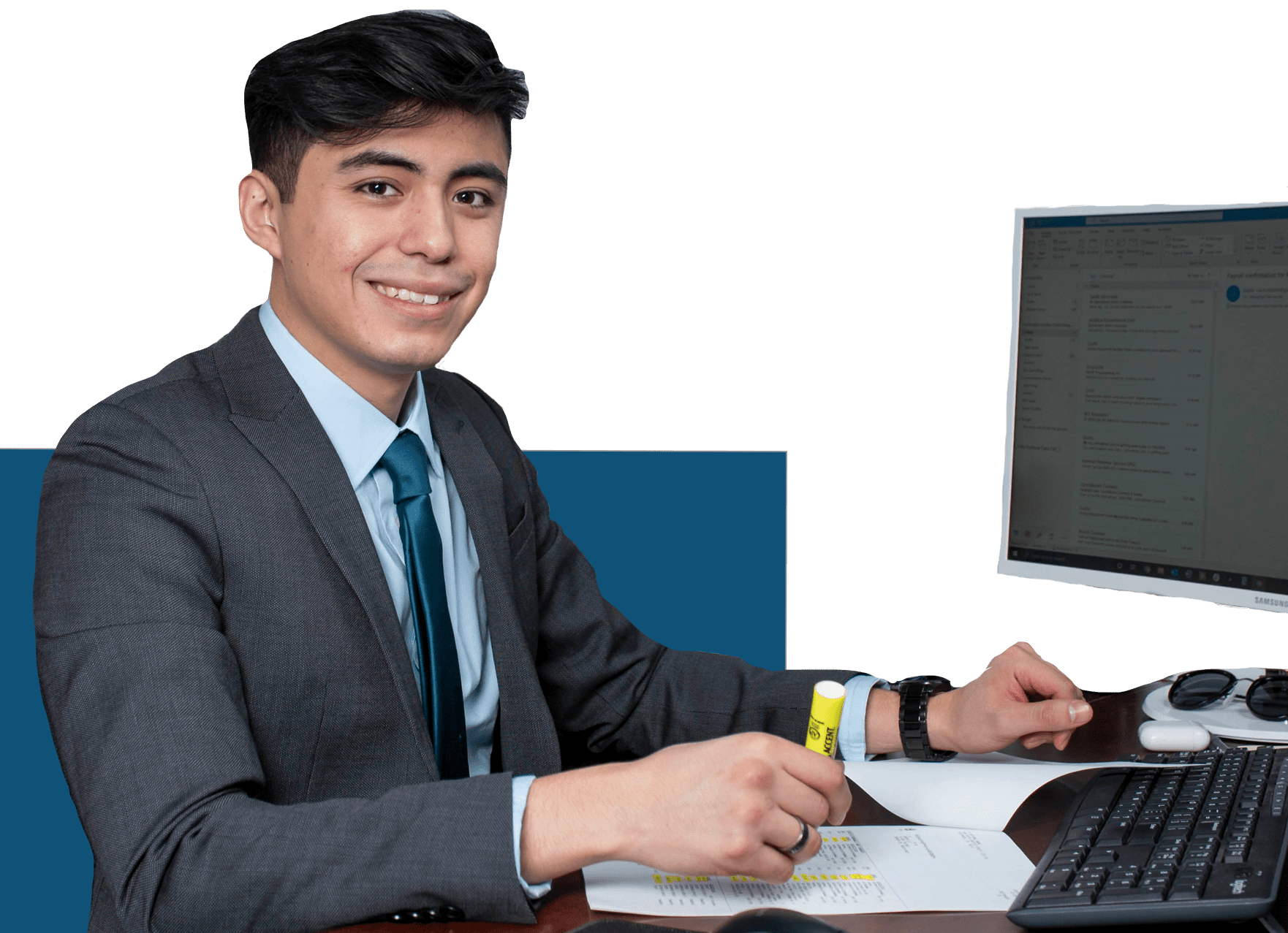 a professional at his desk with a computer