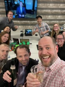 Boxelder Consulting tax firm celebrates its Torch Awards win in office with champagne